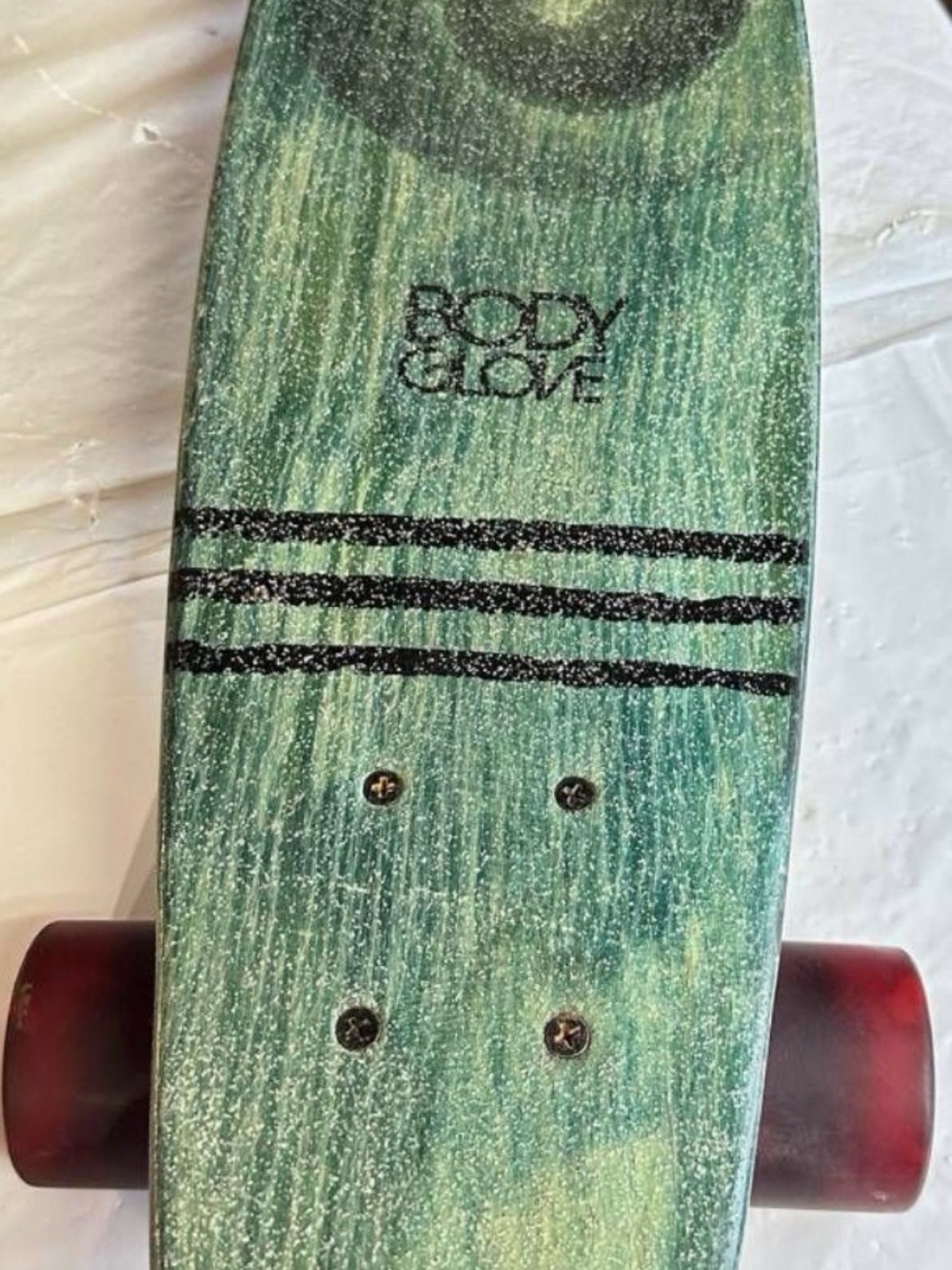 vintage Body Glove skateboard green wood-grain deck with swirl graphic & stripes